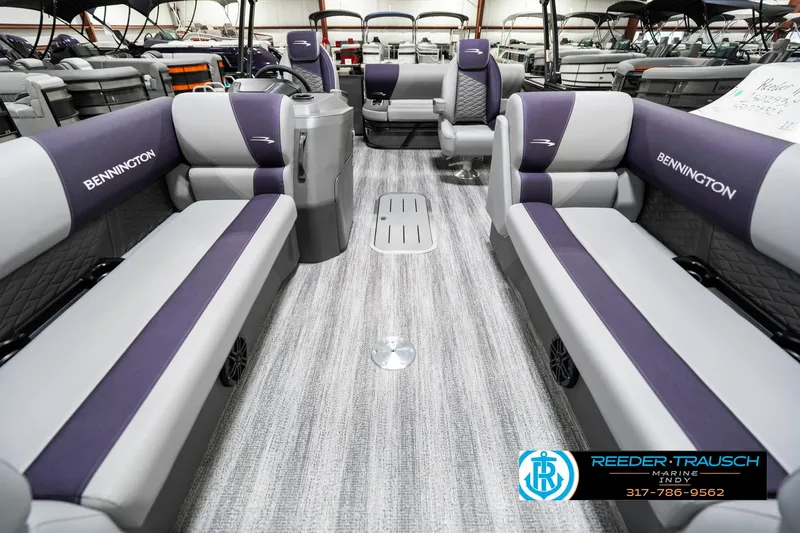 Slide: The Image of 2025 Bennington 21 SSB pontoon boat interior with gray and purple seating. - 16