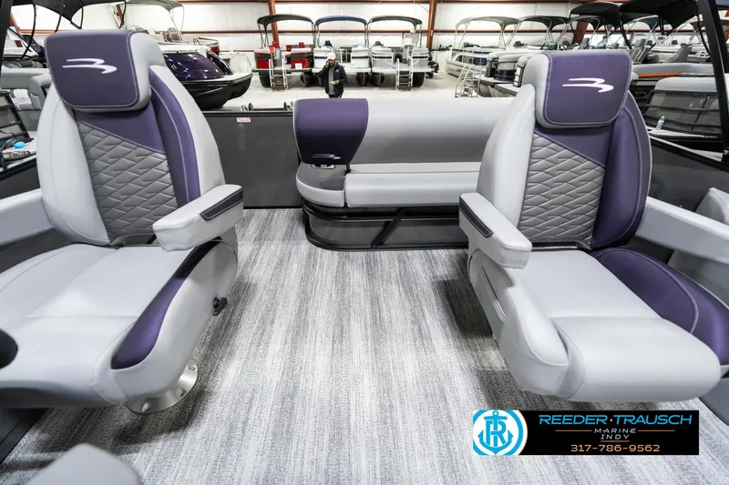 Slide: The Image of 2025 Bennington 21 SSB boat interior with plush seating and modern design. - 17