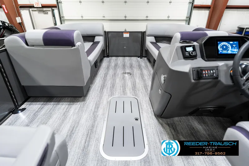 Slide: The Image of 2025 Bennington 21 SSB pontoon boat interior with modern seating and control panel. - 20
