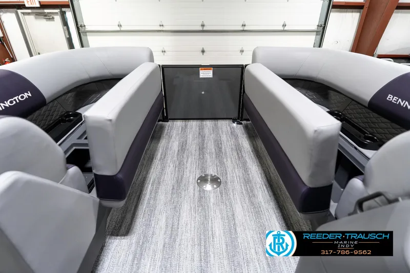 Slide: The Image of 2025 Bennington 21 SSB boat interior with gray seating and carpet flooring. - 22