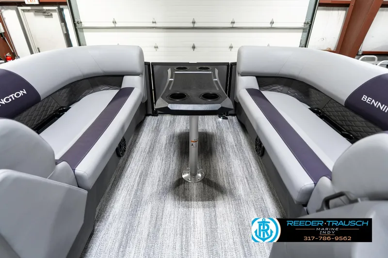 Slide: The Image of 2025 Bennington 21 SSB boat interior with gray seating and central table. - 23