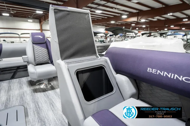 Slide: The Image of 2025 Bennington 21 SSB boat interior with open storage compartment and seating. - 25