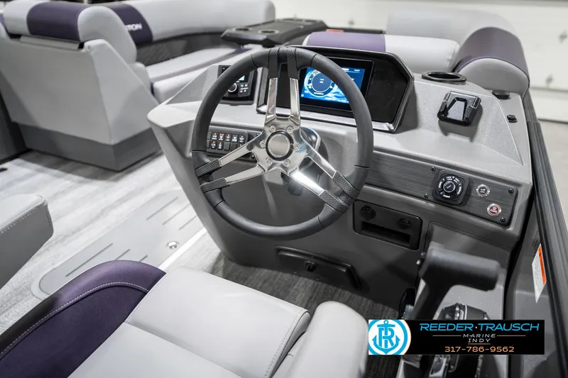 Slide: The Image of 2025 Bennington 21 SSB boat interior with modern steering and dashboard controls. - 32