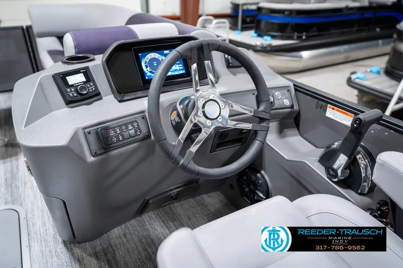 Slide: The Image of 2025 Bennington 21 SSB boat dashboard with steering wheel and control panel. - 33