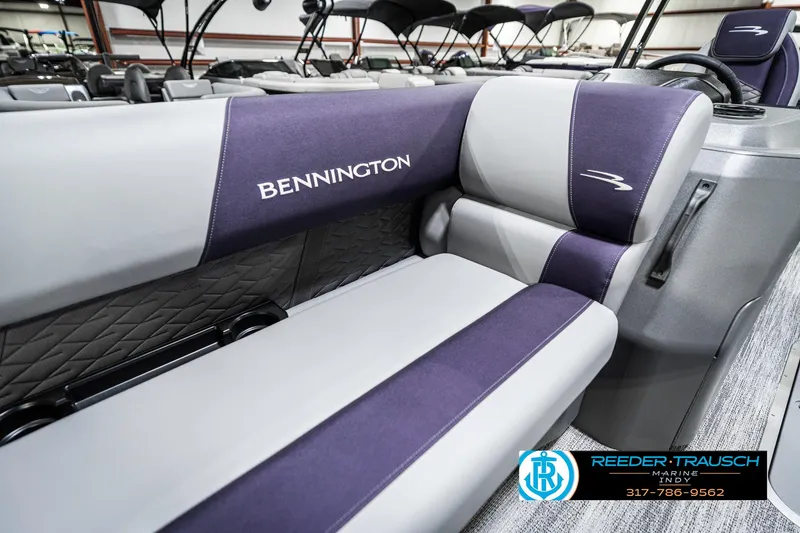 Slide: The Image of 2025 Bennington 21 SSB boat interior with gray and purple seating. - 42