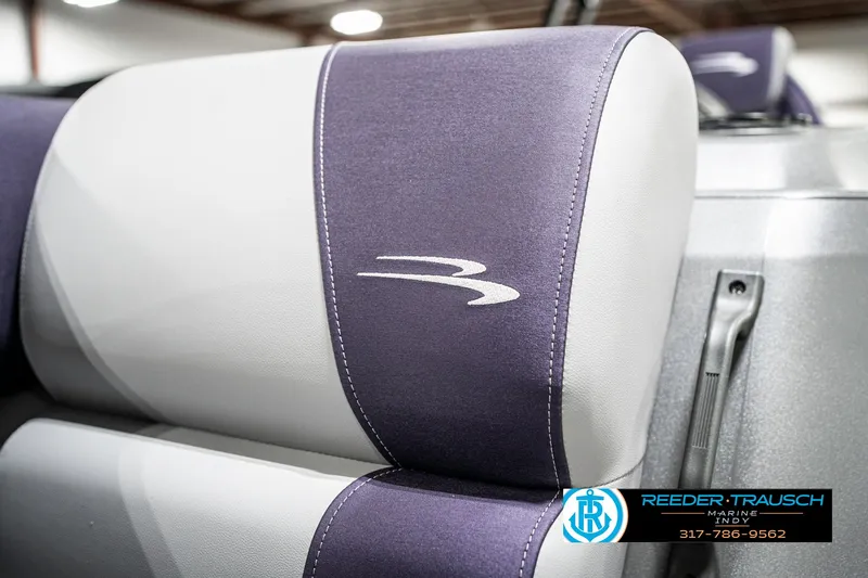 Slide: The Image of 2025 Bennington 21 SSB boat seat with logo, featuring purple and white upholstery. - 46