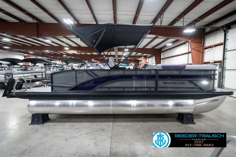 Slide: The Image of 2025 Bennington 21 SSB pontoon boat in showroom with canopy. - 8
