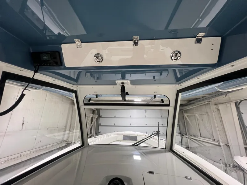Slide: The Image of 2025 Cobia 350 Center Console interior view with modern design and storage compartments. - 12