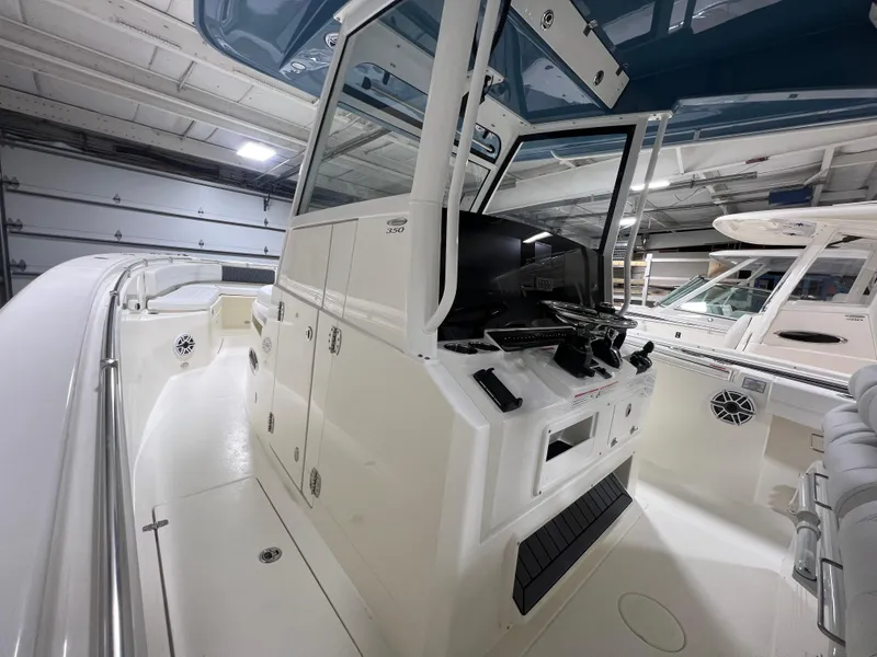 Slide: The Image of 2025 Cobia 350 Center Console boat interior with modern helm and controls. - 14