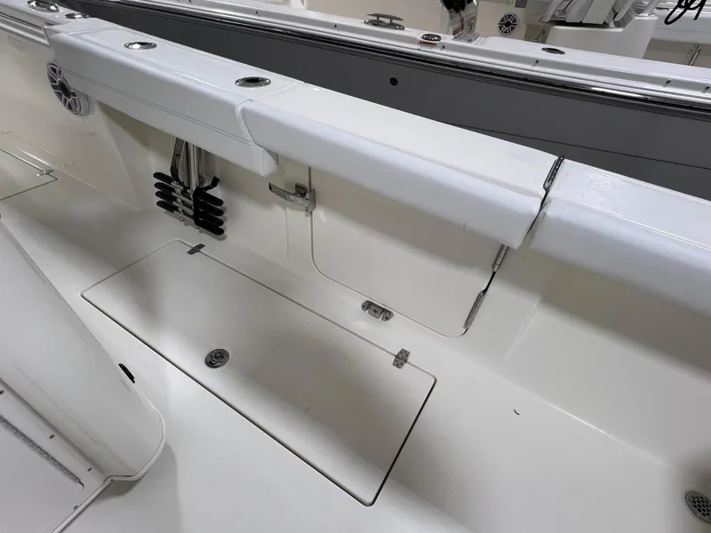 Slide: The Image of 2025 Cobia 350 Center Console boat interior with storage compartments and seating. - 6