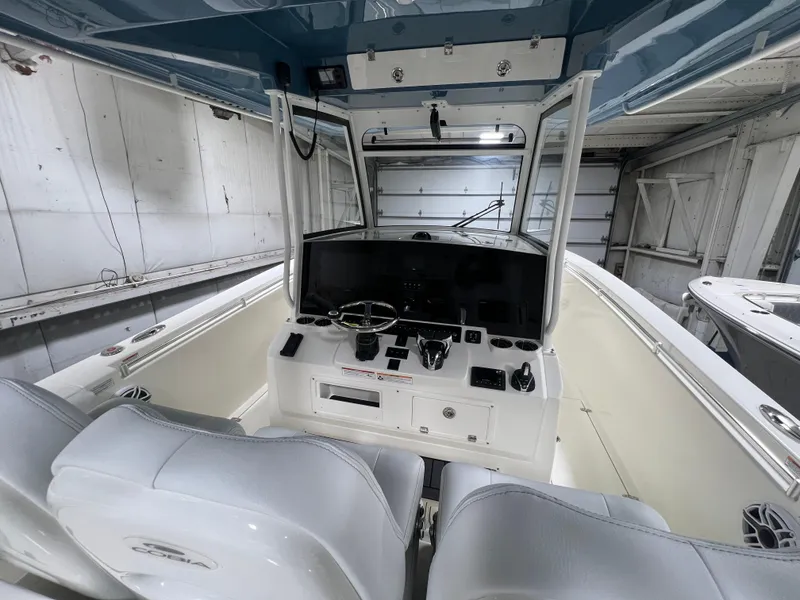 Slide: The Image of 2025 Cobia 350 Center Console boat interior with modern helm and seating. - 9