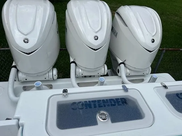 Slide: The Image of 2024 Contender 39 ST boat with triple Yamaha outboard engines. - 3