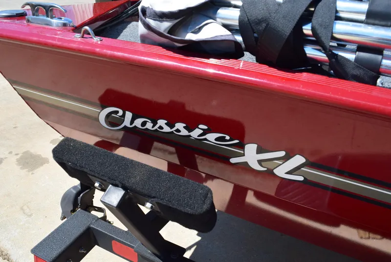 Slide: The Image of 2021 Tracker Bass Tracker Classic XL boat, red exterior with "Classic XL" logo. - 11