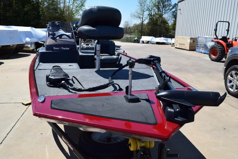 Slide: The Image of 2021 Tracker Bass Tracker Classic XL boat with red exterior, parked outdoors. - 5