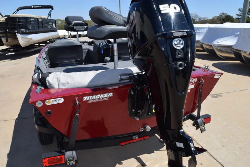 Slide: The Image of 2021 Tracker Bass Tracker Classic XL boat with 50 HP engine, parked outdoors. - 7