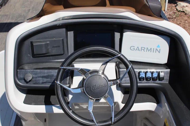 Slide: The Image of Dashboard of 2023 Tahoe Pontoon Cascade Platinum with Garmin navigation system. - 12