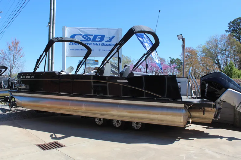 Slide: The Image of 2023 Tahoe Pontoon Cascade Platinum Versatile Rear Bench 25' displayed outdoors. - 3