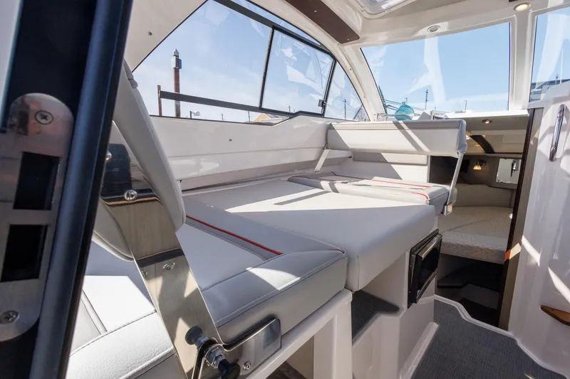 Slide: The Image of 2026 Solara 250-C boat interior with modern seating and sleek design. - 16