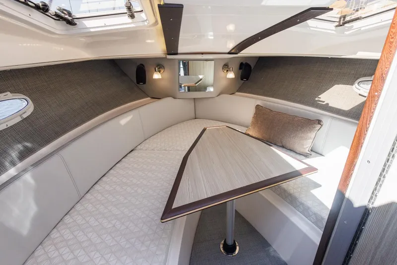 Slide: The Image of Luxurious interior of 2026 Solara 250-C boat with elegant seating and table. - 18