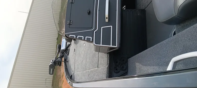Slide: The Image of 2025 Ranger ALPHA 208 boat interior with storage compartments and seating. - 15
