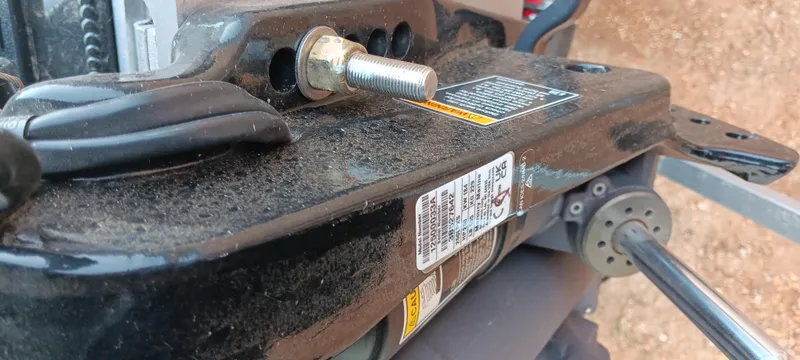 Slide: The Image of Close-up of Ranger ALPHA 208 machinery component, showcasing bolts and labels, 2025 model. - 17