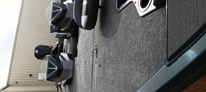 Slide: The Image of 2025 Ranger ALPHA 208 boat interior with carpeted deck and seating. - 6