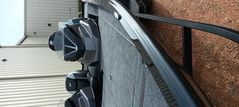 Slide: The Image of 2025 Ranger ALPHA 208 boat on trailer, parked outside a building. - 7