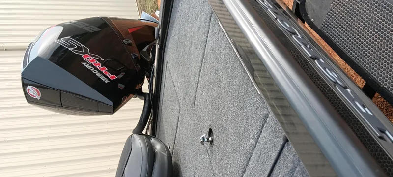 Slide: The Image of Ranger ALPHA 208 boat, 2025 model, featuring a powerful outboard motor. - 9