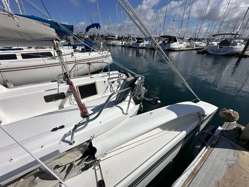 Slide: The Image of Sailboats docked at marina, featuring a 2021 Dragonfly 25 Touring. - 18