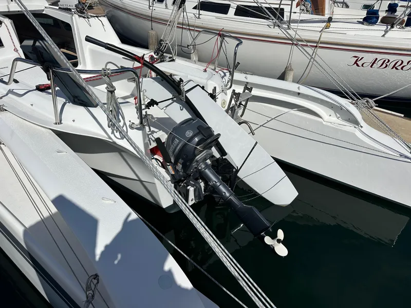 Slide: The Image of 2021 Dragonfly 25 Touring sailboat with outboard motor docked in marina. - 19