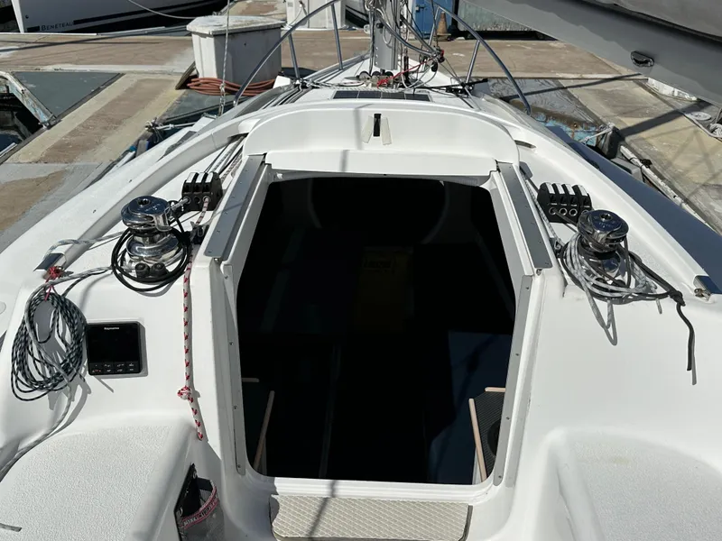 Slide: The Image of Cockpit of 2021 Dragonfly 25 Touring sailboat with winches and ropes, docked at marina. - 24