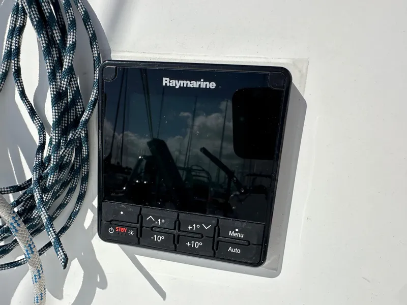 Slide: The Image of Raymarine control panel on 2021 Dragonfly 25 Touring sailboat, with coiled rope nearby. - 26