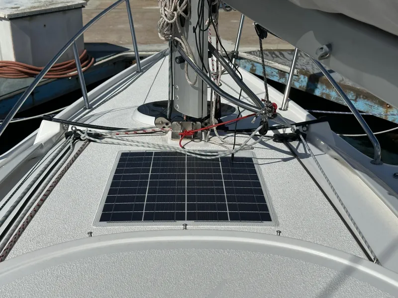 Slide: The Image of Bow of 2021 Dragonfly 25 Touring sailboat with solar panel and rigging. - 27