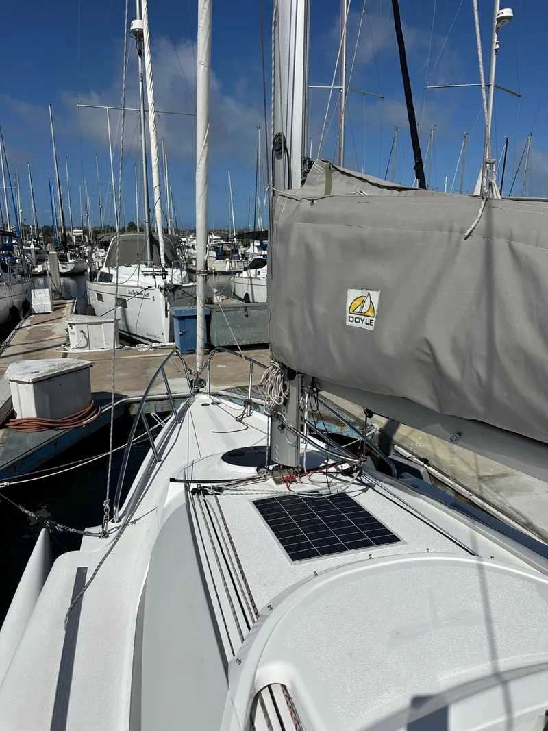 Slide: The Image of 2021 Dragonfly 25 Touring sailboat docked at marina with solar panel on deck. - 28