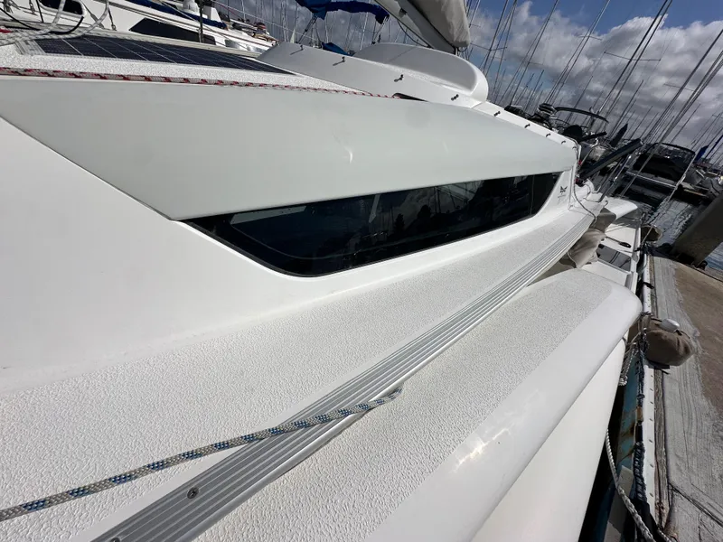 Slide: The Image of 2021 Dragonfly 25 Touring sailboat docked, showcasing sleek design and modern features. - 34