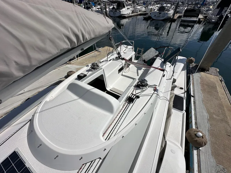 Slide: The Image of 2021 Dragonfly 25 Touring sailboat docked at marina, featuring sleek deck design. - 35