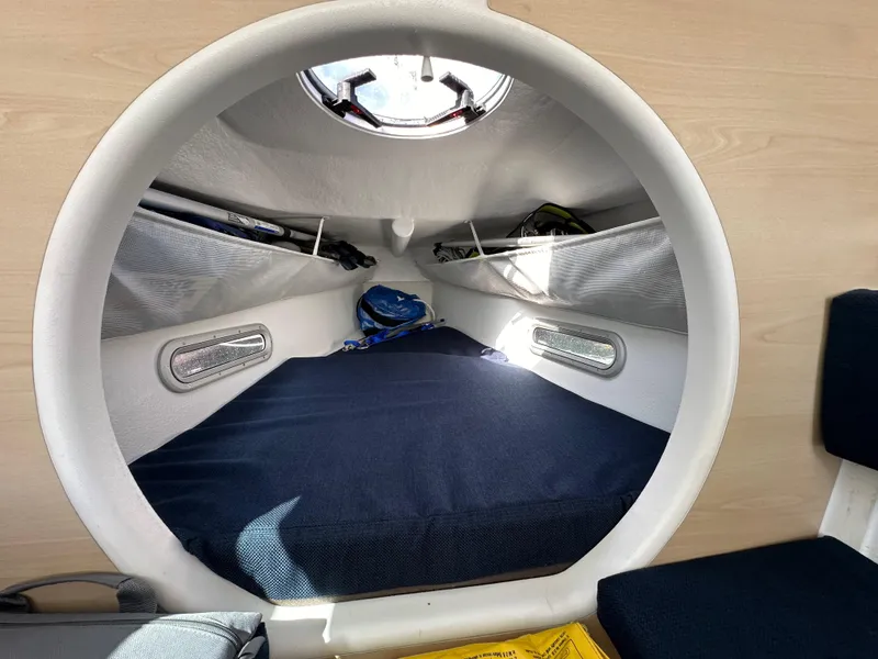 Slide: The Image of Cozy cabin interior of 2021 Dragonfly 25 Touring sailboat with storage and bedding. - 40