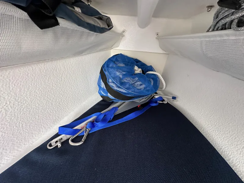 Slide: The Image of Interior storage of 2021 Dragonfly 25 Touring boat with blue rope and clips. - 42