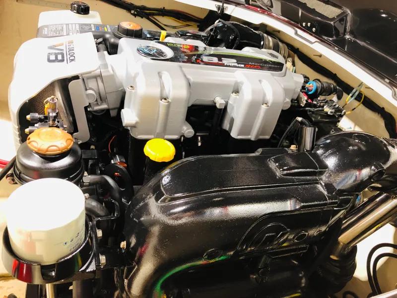 Slide: The Image of 2022 Donzi Classic engine compartment showcasing powerful marine engine components. - 10