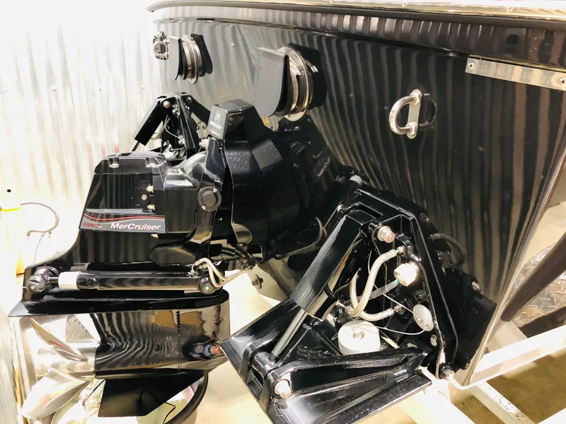 Slide: The Image of 2022 Donzi Classic boat with MerCruiser engine, detailed view of the stern and outdrive components. - 11