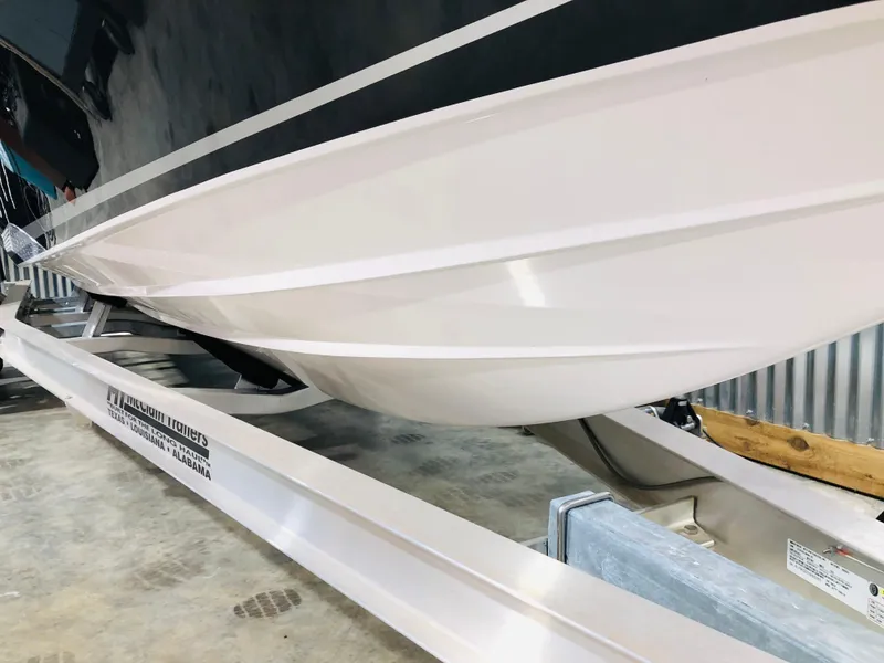 Slide: The Image of 2022 Donzi Classic boat hull on trailer in storage facility. - 8