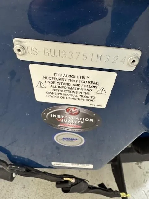 Slide: The Image of 2024 Tahoe 1950 boat identification plate with safety instructions and installation warranty sticker. - 10