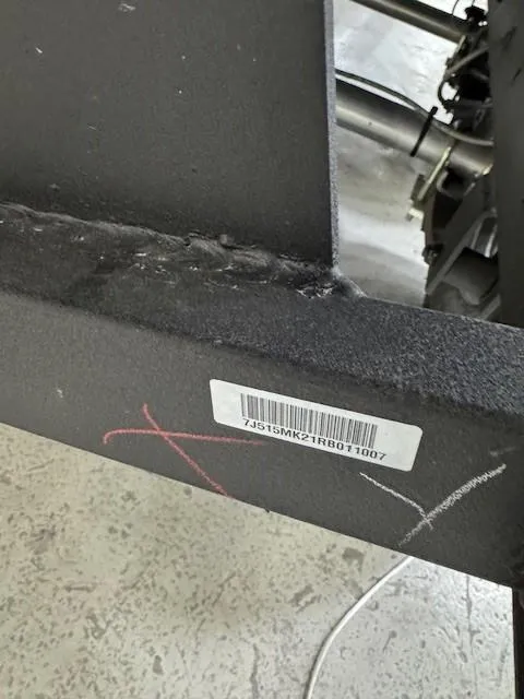 Slide: The Image of Close-up of a 2024 Tahoe 1950 vehicle part with a visible barcode and markings. - 11