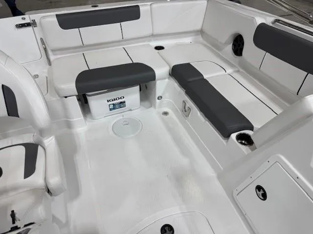Slide: The Image of Spacious seating area in 2024 Tahoe 1950 boat with white and gray upholstery. - 8