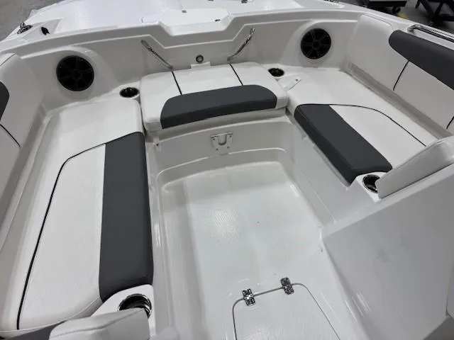Slide: The Image of Interior of 2024 Tahoe 1950 boat with white and gray seating. - 9