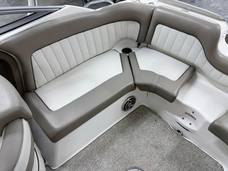 Slide: The Image of 2009 Yamaha Boats 232 Limited S interior seating with beige and white upholstery. - 12