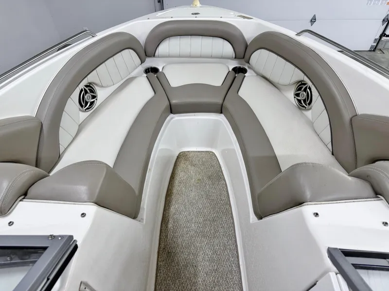 Slide: The Image of 2009 Yamaha Boats 232 Limited S interior with gray seating and carpeted flooring. - 19