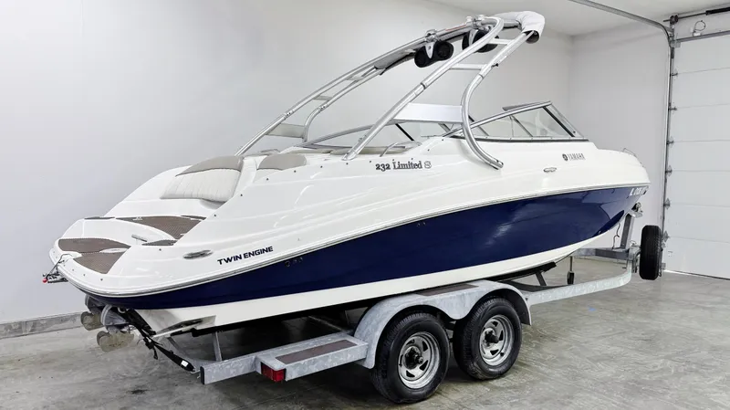 Slide: The Image of 2009 Yamaha Boats 232 Limited S on trailer in garage, side view. - 2