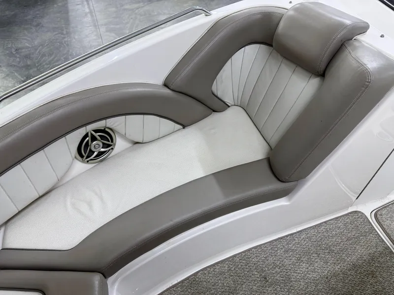 Slide: The Image of 2009 Yamaha Boats 232 Limited S interior seating with gray and white upholstery. - 21