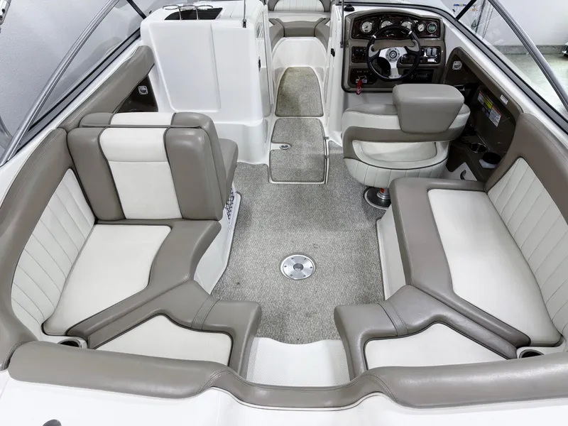 Slide: The Image of 2009 Yamaha Boats 232 Limited S interior with plush seating and modern dashboard. - 5